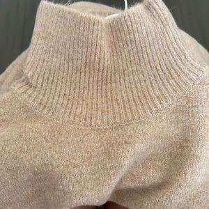 Zara High collar sweater with long sleeves.